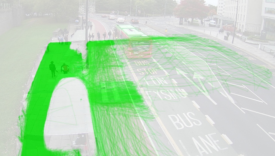 The above photo but faded, with green lines superimposed to show the paths of individual pedestrians. 